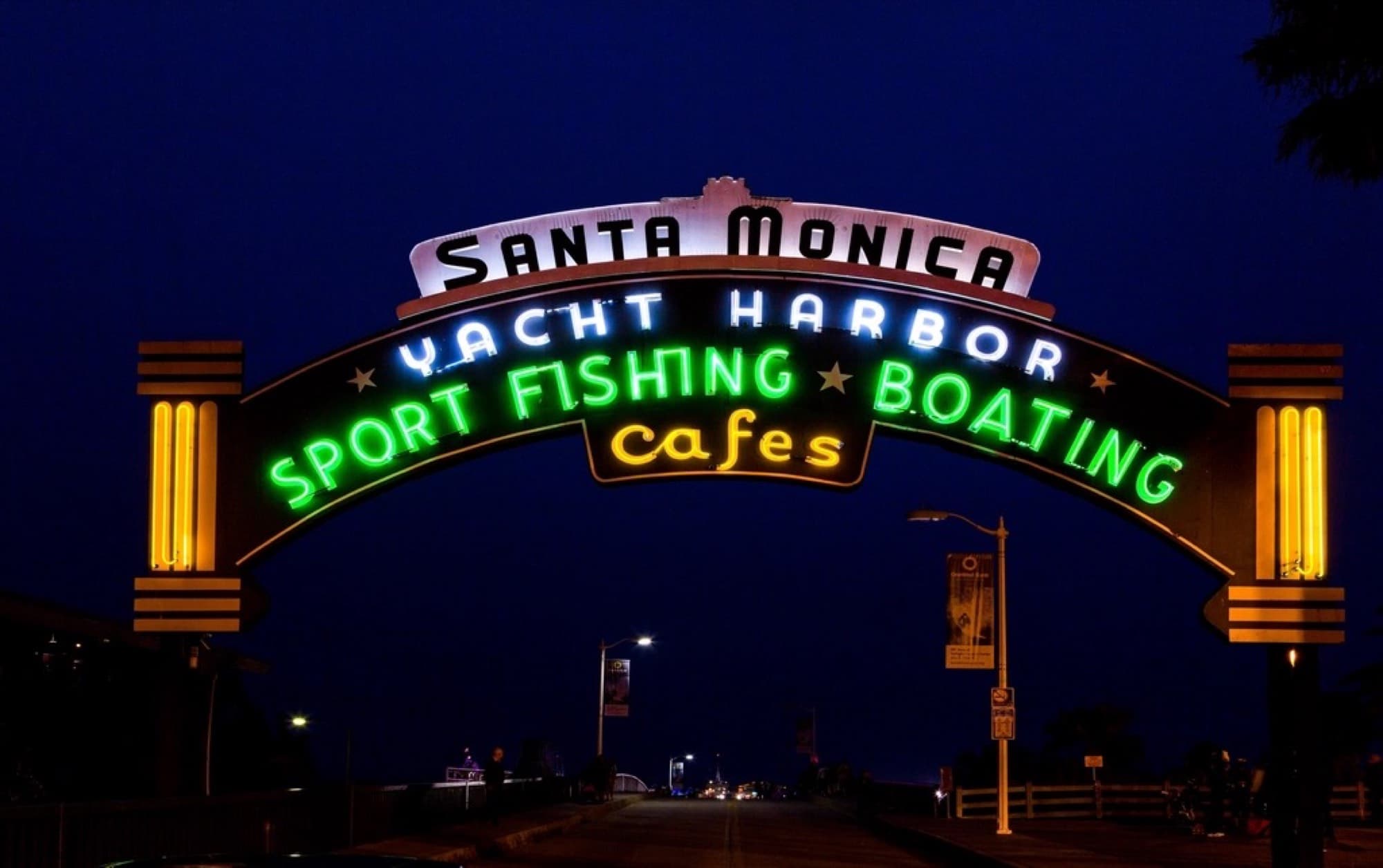 The illuminated Santa Monica Yacht Harbor sign at night